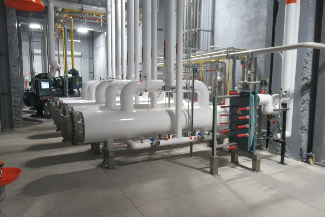 Shell-and-tube heat exchangers installed in an industrial machine room
